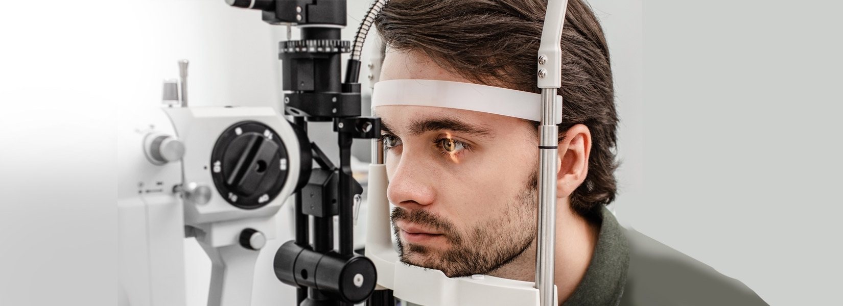 young man during eye exam in Manchester